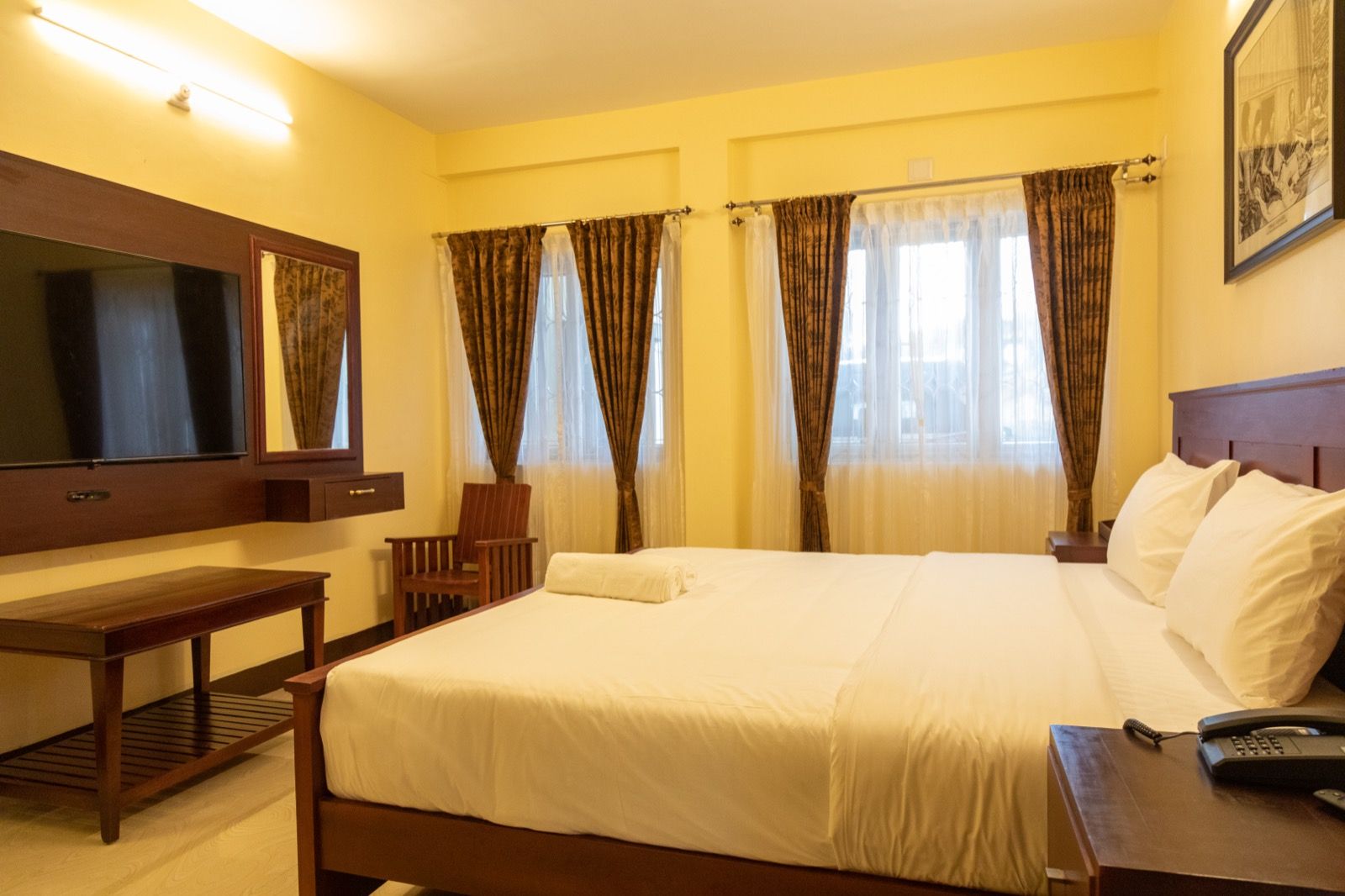 Luxury room at Aakash with a large bed and generous space